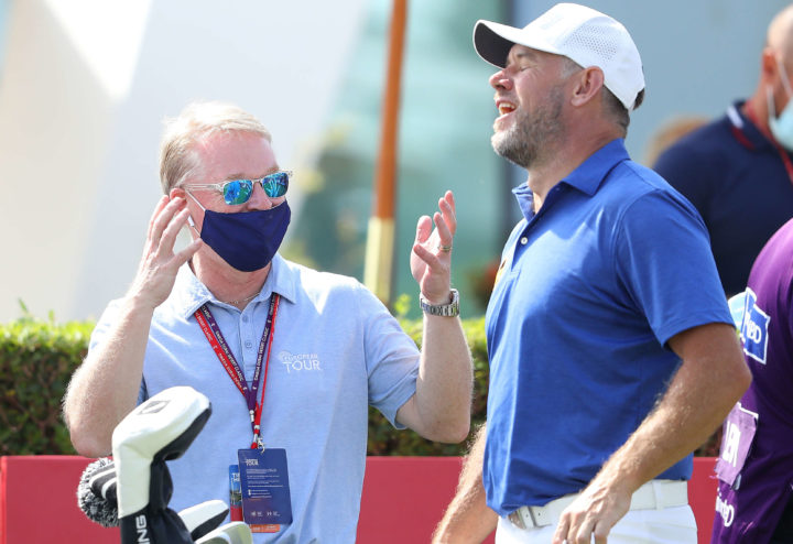 DUBAI, UNITED ARAB EMIRATES - JANUARY 31: Keith Pelley, CEO of the PGA European Tour, speaks to Lee Westwood of England on 1st tee during the final round of the Omega Dubai Desert Classic at Emirates Golf Club on January 31, 2021 in Dubai, United Arab Emirates. (Photo by Warren Little/Getty Images)