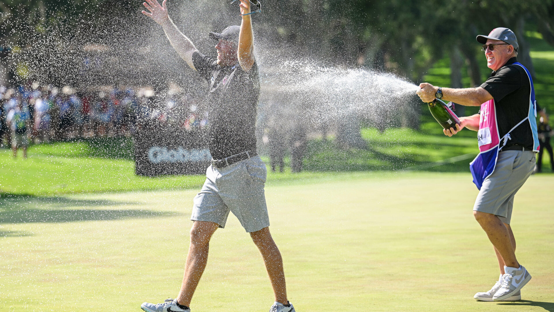 CADIZ, SPAIN - JULY 2: Talor Gooch of RangeGoats GC is sprayed with champagne by his caddy after sinking a birdie putt on the 18th hole and wins the LIV Golf - Andalucia at Real Club Valderrama on July 2, 2023 in Cadiz, Spain. (Photo by Octavio Passos/Getty Images) tour news