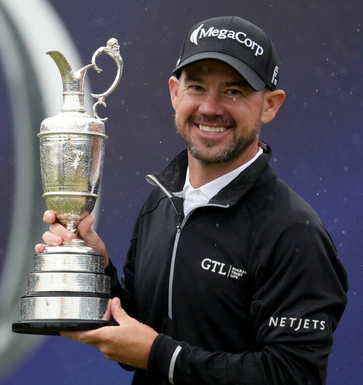 HOYLAKE, ENGLAND - JULY 23: Brian Harman of the United States poses for a photograph with the Claret Jug on the 18th green after winning The 151st Open on Day Four of The 151st Open at Royal Liverpool Golf Club on July 23, 2023 in Hoylake, England. (Photo by Warren Little/Getty Images)