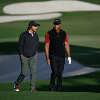 AUGUSTA, GEORGIA - APRIL 14: Tiger Woods with his son Charlie as he makes his way around the practice range for the final round of Masters Tournament at Augusta National Golf Club on April 14, 2024 in Augusta, Georgia. (Photo by Ben Jared/PGA TOUR via Getty Images)